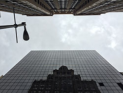 Reflection of the Niels Esperson Building. Completed in 1927, is is 32 stories tall. It was the tallest building in Houston from 1927 to 1929. Reflection of the Niels Esperson Building